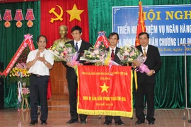 Đồng hành cùng lịch sử 65 năm Ngân hàng Việt Nam