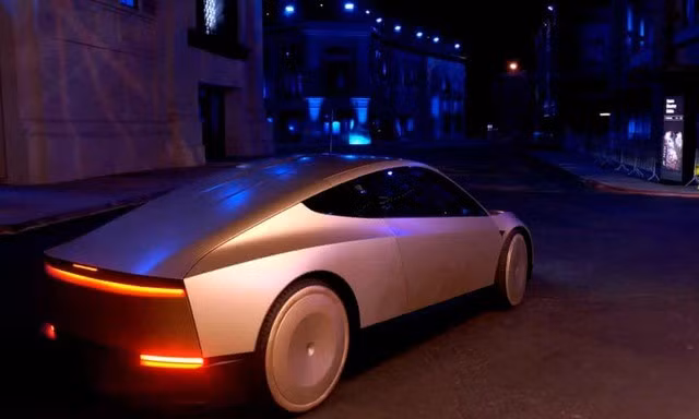 Tỉ phú Elon Musk cho biết Cybercab của Tesla sẽ không có vô lăng hay bàn đạp và sẽ sử dụng sạc cảm ứng thay vì phích cắm. Ảnh: Tesla/Reuters