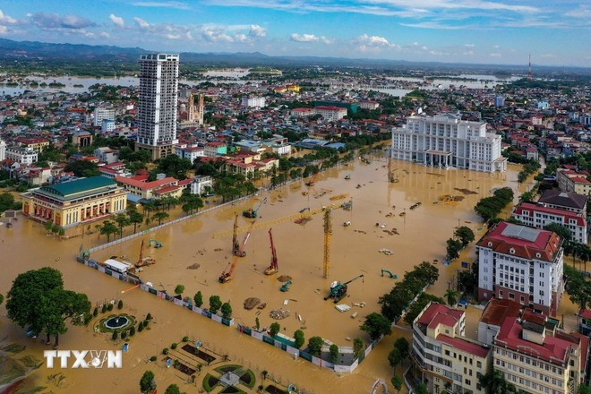 Khu vực trung tâm của tỉnh Thái Nguyên ngập sâu trong nước lũ. (Ảnh: Phạm Tuấn Anh/TTXVN) Khu vực trung tâm của tỉnh Thái Nguyên ngập sâu trong nước lũ. (Ảnh: Phạm Tuấn Anh/TTXVN)