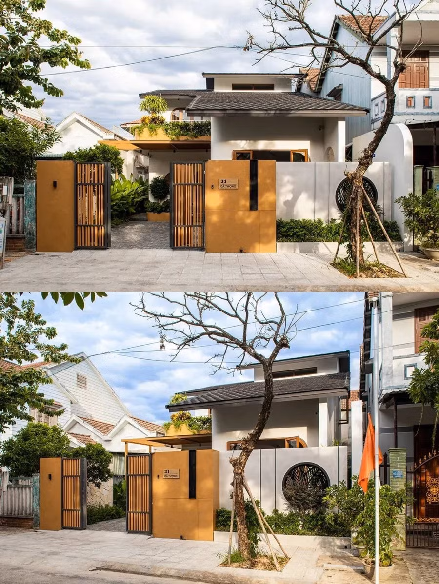 Mặt tiền gây ấn tượng với tông terracota ấm áp và những ô cửa tròn hiện đại.