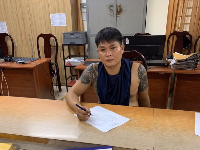 Trần Quang Đạt tại cơ quan công an. Ảnh: Trị Bình