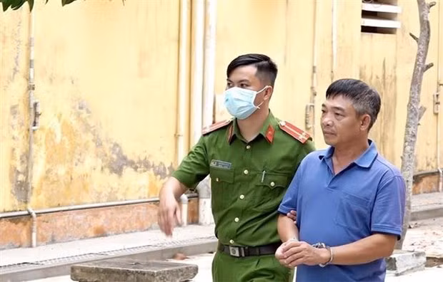 Lê Văn Trường được áp giải về nơi tạm giam. (Ảnh: TTXVN phát)