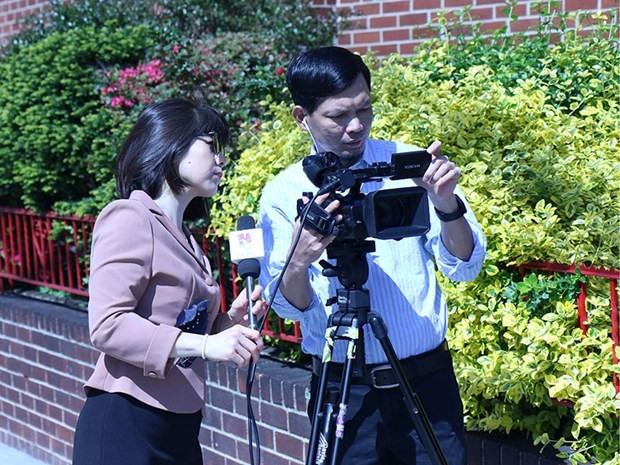 Phóng viên tác nghiệp. (Nguồn: TTXVN) Phóng viên tác nghiệp. (Nguồn: TTXVN)