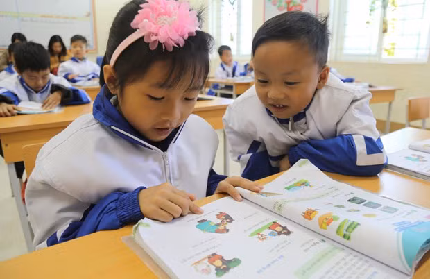 Nếu mức sàn học phí giảm sẽ là cơ sở để các địa phương giảm học phí. (Ảnh: PV/Vietnam+) Nếu mức sàn học phí giảm sẽ là cơ sở để các địa phương giảm học phí. (Ảnh: PV/Vietnam+)