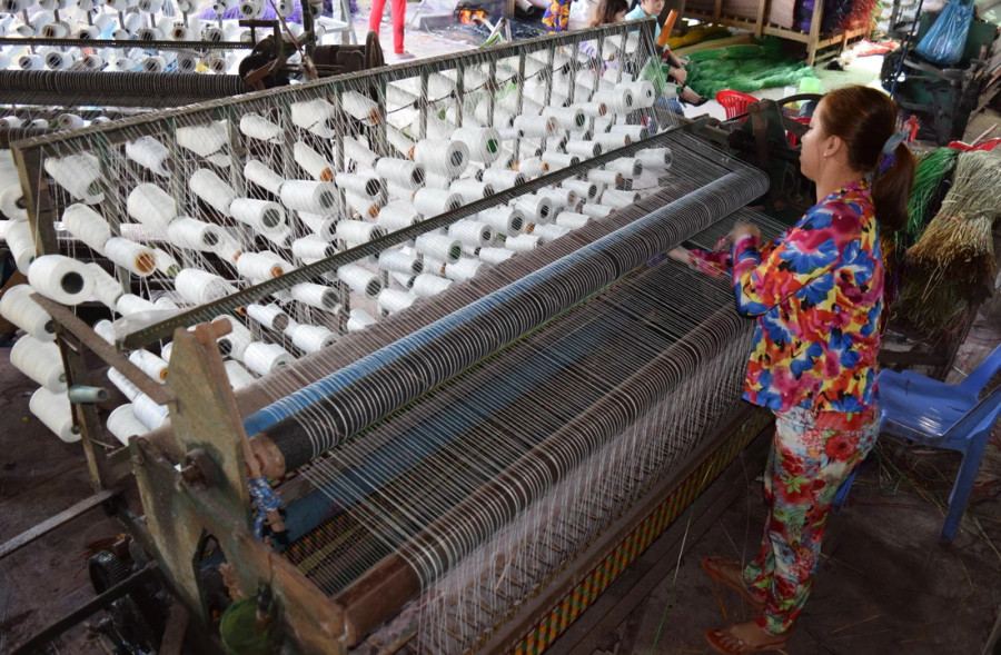 Một máy dệt chiếu. (Ảnh minh họa. Chương Đài/TTXVN) Một máy dệt chiếu. (Ảnh minh họa. Chương Đài/TTXVN)