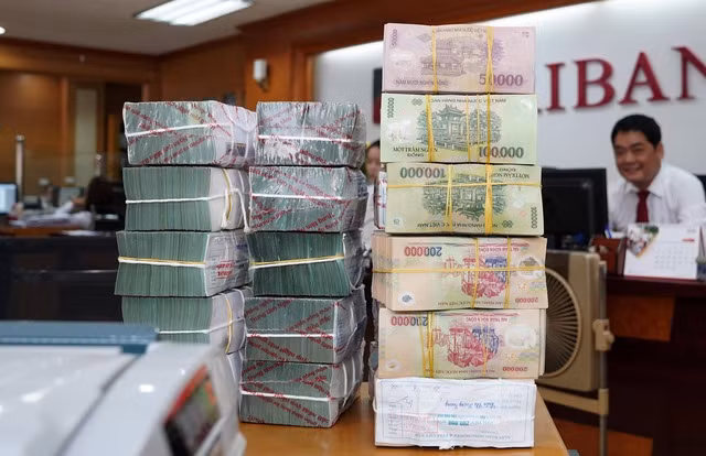 Ngân hàng Nhà nước chỉ đạo giảm lãi suất thêm 1,5 - 2%/năm. Ảnh: NGỌC THẮNG