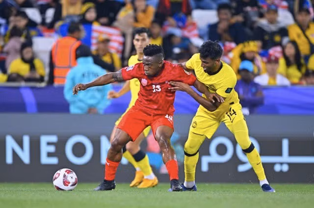 Malaysia (phải) sớm bị loại. Ảnh: AFC