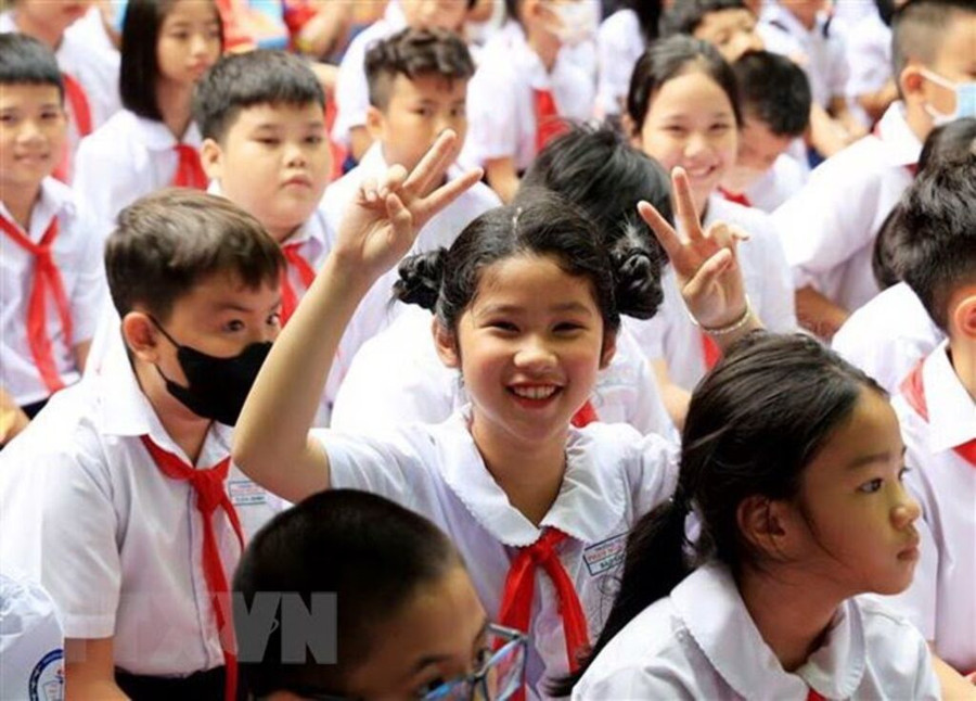 Học sinh ở Thành phố Hồ Chí Minh vui mừng chào đón Năm học mới 2023-2024. Ảnh minh họa: Hồng Đạt/TTXVN