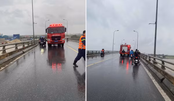 Đội Cảnh sát PCCC-CNCH , Công an huyện Tiên Lãng hỗ trợ che chắn cho người dân đi qua cầu