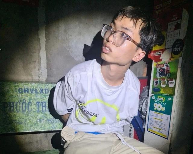 Bị can Lại Thế Việt lúc bị bắt. Ảnh: NAM LONG