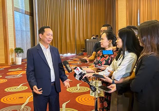 Phó Thống đốc NHNN Đào Minh Tú trả lời phỏng vấn báo chí. (Ảnh: PV/Vietnam+)