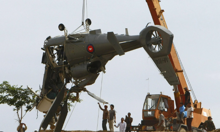 Xác trực thăng rơi ở khu vực sườn núi Yav Yai. (Nguồn: China Morning Post) Xác trực thăng rơi ở khu vực sườn núi Yav Yai. (Nguồn: China Morning Post)