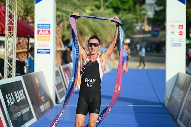 Hình ảnh vận động viên Phạm Tiến Sản về nhất tại vạch đích. (Ảnh: AKP/TTXVN phát) Hình ảnh vận động viên Phạm Tiến Sản về nhất tại vạch đích. (Ảnh: AKP/TTXVN phát)