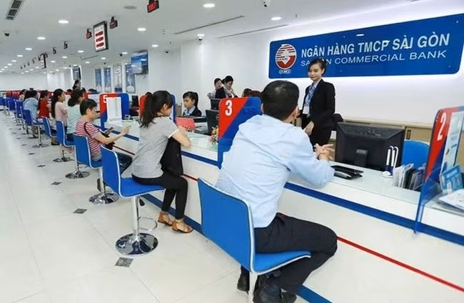 Giao dịch tại SCB. (Ảnh: CTV/Vietnam+) Giao dịch tại SCB. (Ảnh: CTV/Vietnam+)