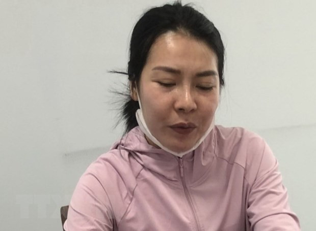 Đối tượng Phạm Thị Huỳnh Như tại cơ quan công an. (Ảnh: TTXVN phát)