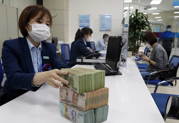 Mặt bằng lãi suất thị trường đã có xu hướng giảm. (Ảnh: PV/Vietnam+) Mặt bằng lãi suất thị trường đã có xu hướng giảm. (Ảnh: PV/Vietnam+)
