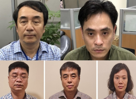 Bị can phía trên Trần Hùng (trái) và Nguyễn Duy Hải cùng 3 bị can QLTT phía dưới.