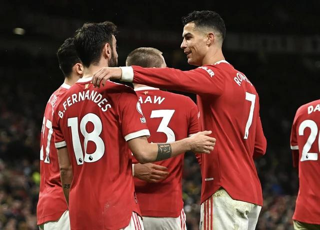 Bruno Fernandes (trái) và Ronaldo từng thi đấu cùng CLB M.U trước đây. Ảnh AFP