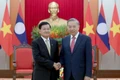Tổng Bí thư Tô Lâm (bìa phải) và Tổng Bí thư, Chủ tịch nước Lào Thongloun Sisoulith.