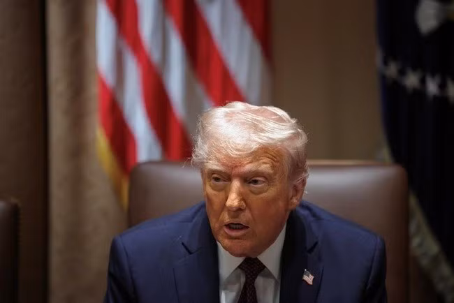 Tổng thống Mỹ Donald Trump tại cuộc họp nội các ở Nhà Trắng ngày 24.3 - Ảnh: REUTERS.