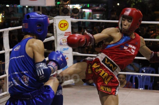 Nguyễn Kế Nhơn (bên phải) trong trận đấu kickboxing với võ sĩ Huỳnh Văn Tuấn (vô địch hạng cân 51 kg nam SEA Games 30). Ảnh: NVCC Nguyễn Kế Nhơn (bên phải) trong trận đấu kickboxing với võ sĩ Huỳnh Văn Tuấn (vô địch hạng cân 51 kg nam SEA Games 30). Ảnh: NVCC