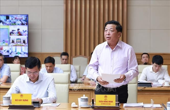 Bộ trưởng Bộ Xây dựng Trần Hồng Minh báo cáo kết quả và nhiệm vụ trọng tâm các dự án trọng điểm ngành giao thông vận tải. Ảnh: Dương Giang/TTXVN Bộ trưởng Bộ Xây dựng Trần Hồng Minh báo cáo kết quả và nhiệm vụ trọng tâm các dự án trọng điểm ngành giao thông vận tải. Ảnh: Dương Giang/TTXVN