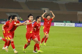 Đội tuyển U23 Việt Nam ăn mừng chiến thắng kịch tính trước đối thủ tại vòng tứ kết, chính thức giành quyền vào bán kết Giải vô địch bóng đá U23 châu Á 2026.