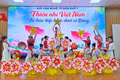 Tiết mục “Thiếu nhi Việt Nam tự hào tiếp bước dưới cờ Đảng” của đội văn nghệ tổ dân phố 1. Ảnh: Bá Bính
