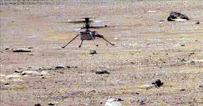 Trực thăng Ingenuity của NASA hạ cánh trên bề mặt Sao Hỏa ngày 7/5/2021. Ảnh tư liệu: AFP/TTXVN Trực thăng Ingenuity của NASA hạ cánh trên bề mặt Sao Hỏa ngày 7/5/2021. Ảnh tư liệu: AFP/TTXVN