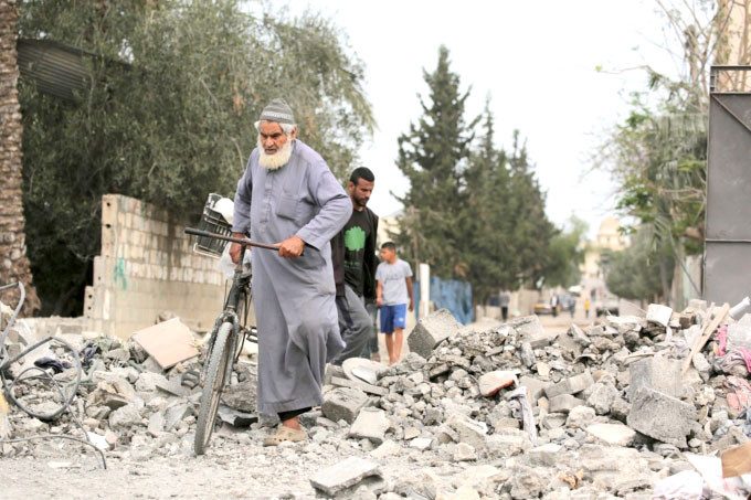 Cảnh hoang tàn ở Al-Zawayda, miền trung Dải Gaza, sau trận không kích của Israel ngày 11-5. Ảnh: AFP Cảnh hoang tàn ở Al-Zawayda, miền trung Dải Gaza, sau trận không kích của Israel ngày 11-5. Ảnh: AFP