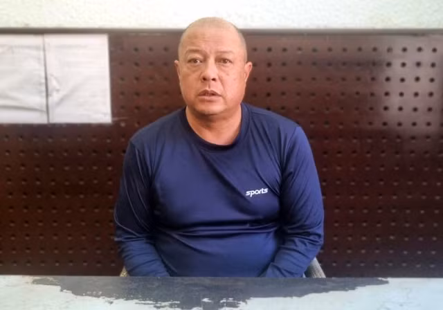 Nguyễn Vũ Nhật Quang tại cơ quan công an.