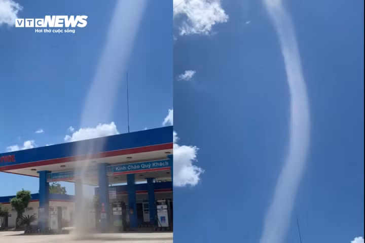 Cơn lốc xoáy cao khoảng 50m xuất hiện gần một cửa hàng xăng dầu. (Ảnh cắt từ clip)