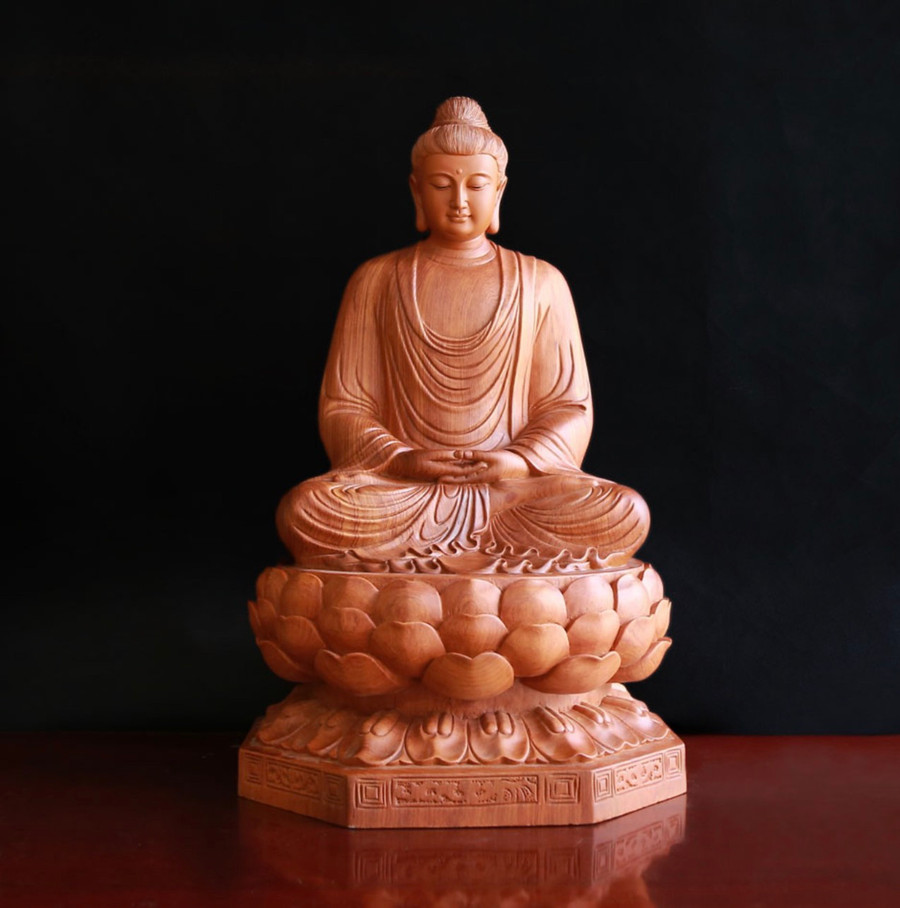 Tượng Bổn Sư bằng gỗ hương, cao 40 cm, ngang 25 cm, một trong 4 pho tượng bị đánh cắp. Ảnh: Chùa Bửu Minh Tượng Bổn Sư bằng gỗ hương, cao 40 cm, ngang 25 cm, một trong 4 pho tượng bị đánh cắp. Ảnh: Chùa Bửu Minh