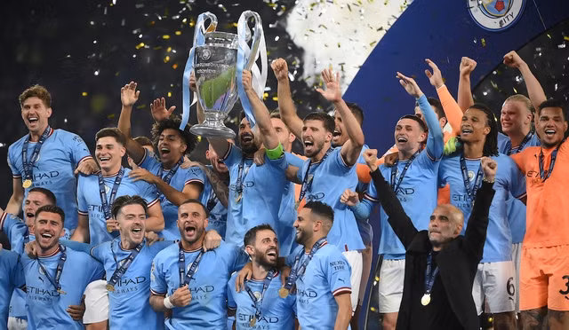 Man City hoàn tất cú ăn ba danh hiệu mùa này. Ảnh: AFP