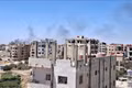 Khói bốc lên sau các cuộc không kích của Israel xuống thành phố Sweida, miền Nam Syria ngày 15-7-2025. Ảnh: THX/TTXVN