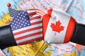 Mỹ và Canada tiếp tục “ăn miếng trả miếng” trong cuộc chiến thương mại. Ảnh: GHY International