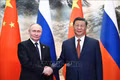 Chủ tịch Trung Quốc Tập Cận Bình (phải) và Tổng thống Nga Vladimir Putin tại cuộc gặp ở Bắc Kinh ngày 16-5-2024. Ảnh tư liệu: AFP/TTXVN