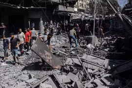 Những ngôi nhà bị phá huỷ trong vụ không kích của Israel xuống thành phố Gaza