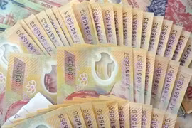 Cảnh báo tiền giả mới mệnh giá 100.000 và 200.000 đồng