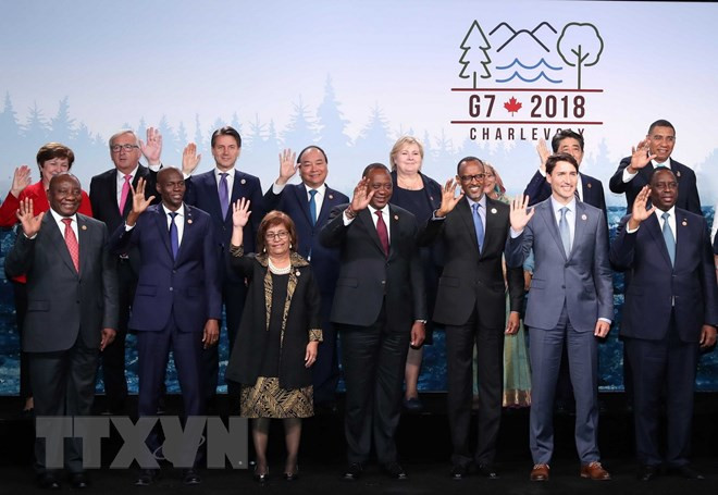 Thủ tướng Nguyễn Xuân Phúc và các trưởng đoàn G7 và G7 mở rộng. (Ảnh: Thống Nhất/TTXVN)