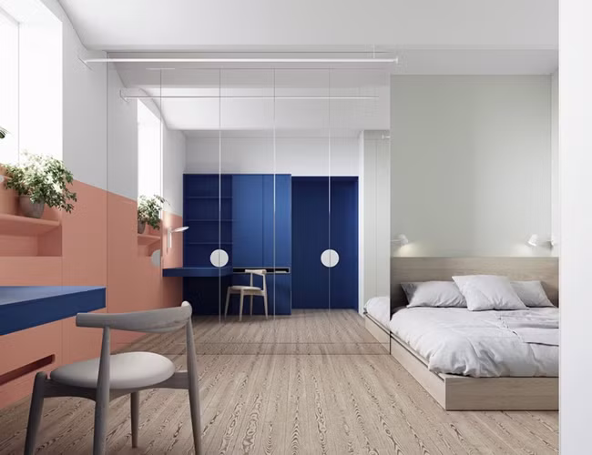  Phòng ngủ cũng được sử dụng những gam màu sôi nổi, một tấm gương lớn giúp tăng chiều rộng cho căn phòng.