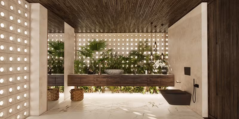 Một phần tường phòng tắm được trang trí bằng cây xanh.