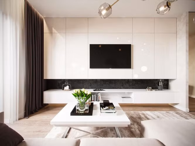 Kệ tivi màu trắng kết hợp hoàn hảo với bức tường bên trên.
