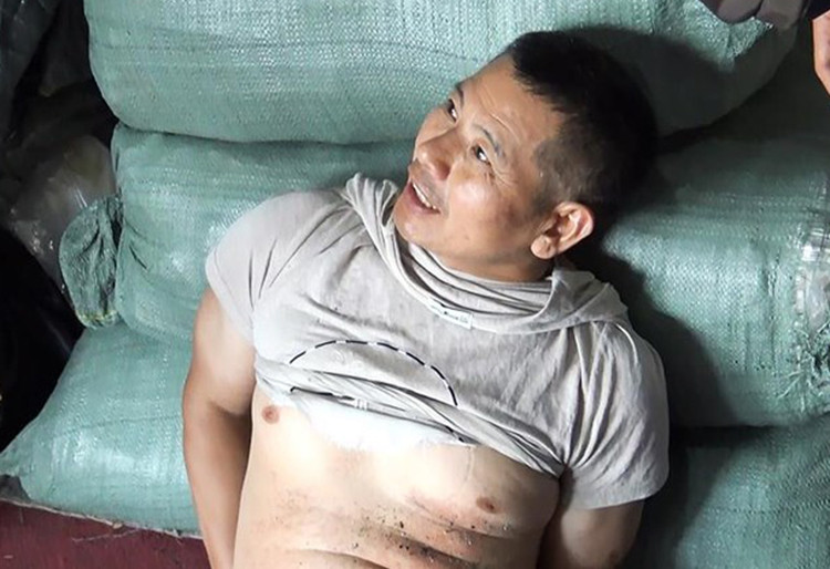 Huang Zai Wen bị bắt tại hiện trường. Ảnh: Pháp luật TP HCM.