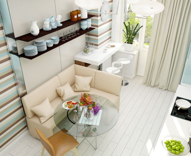 Với nhà có diện tích nhỏ, bếp ăn và bàn tiếp khách được tận dụng kê gần nhau. Trên tường là giá để đồ, cốc chén. 