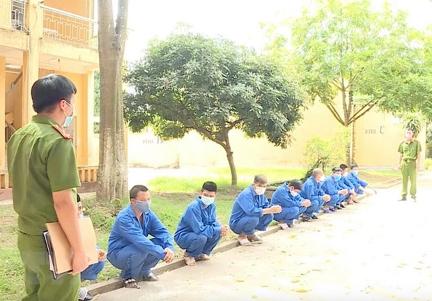  Các đối tượng tại cơ quan công an. (Ảnh: Đinh Tuấn/TTXVN)