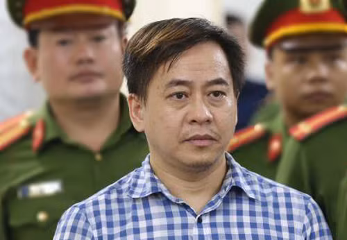 Ông Phan Văn Anh Vũ tại TAND Hà Nội ngày 30/7. Ảnh: TTXVN