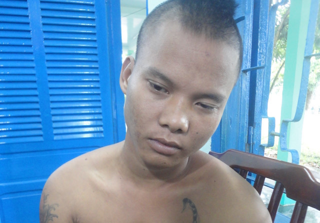 Bình tại cơ quan công an sau khi gây ra vụ phóng hoả. Ảnh: C.A.