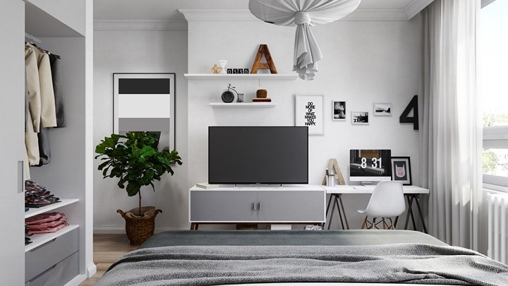 Cuối giường kệ ti vi, bàn làm việc sắp xếp khéo léo để người sử dụng không cảm thấy bức bí và lộn xộn.
