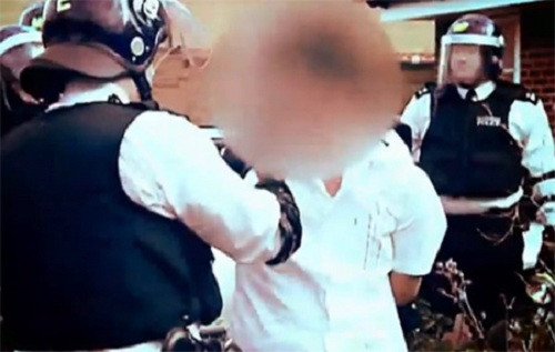 Một thanh niên Việt Nam bị cảnh sát Anh bắt giữ. - Ảnh: Aljazeera